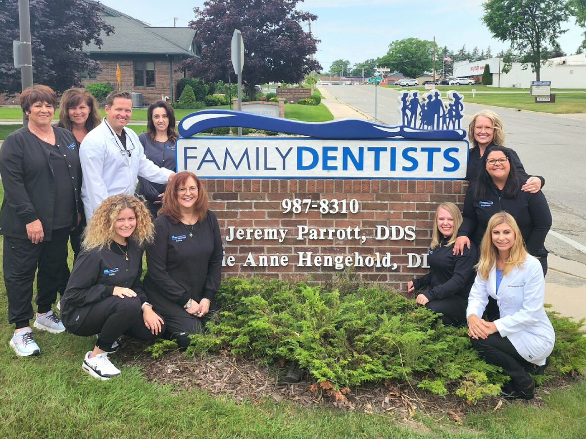 Dr. Parrott, Dr. Hengehold, and the Family Dentists PLLC team smiling together